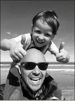 Danny Matharu with his child on his shoulders